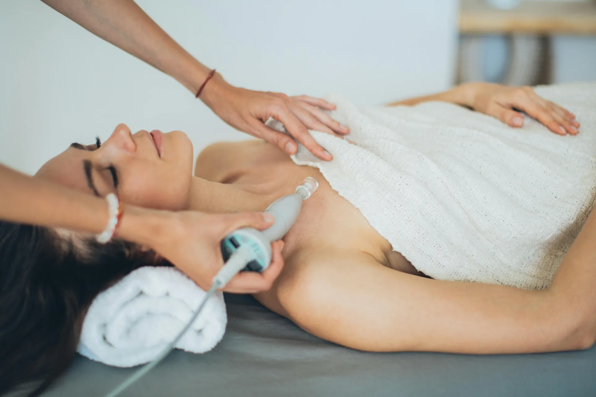 Close-up of a spa laser device being applied to the skin